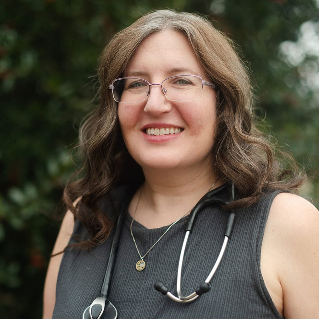 Portrait photo of Dr. Russell wearing a stethoscope.